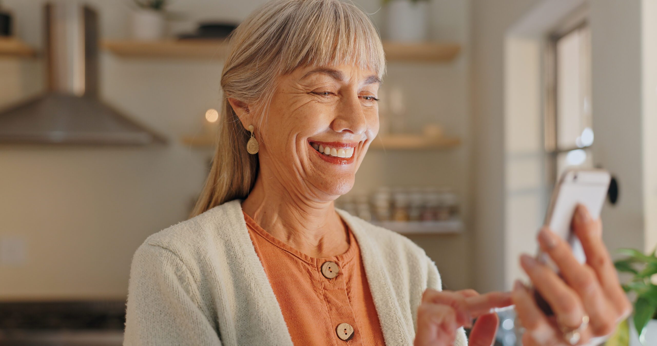 HOME-H~1 Home, happy and elderly woman with phone for news website, network and learning on technology. House, internet and senior person with smartphone for digital media, information or online communication.