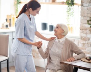 Support worker caring for elderly woman with dementia