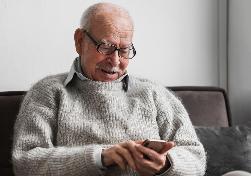 Older man using mobile phone