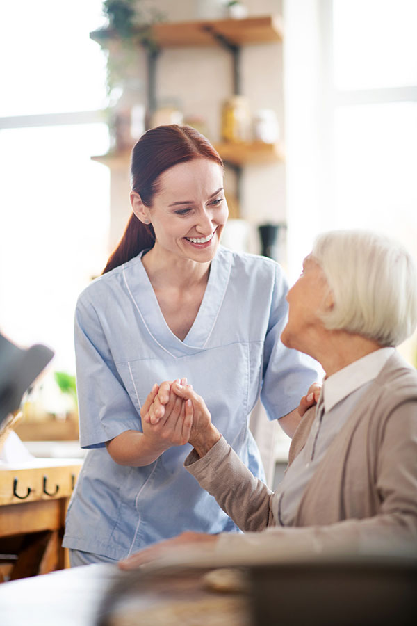 caregiver-enjoying-work-while-communicating-with-pensioner - Australian Capital Territory 